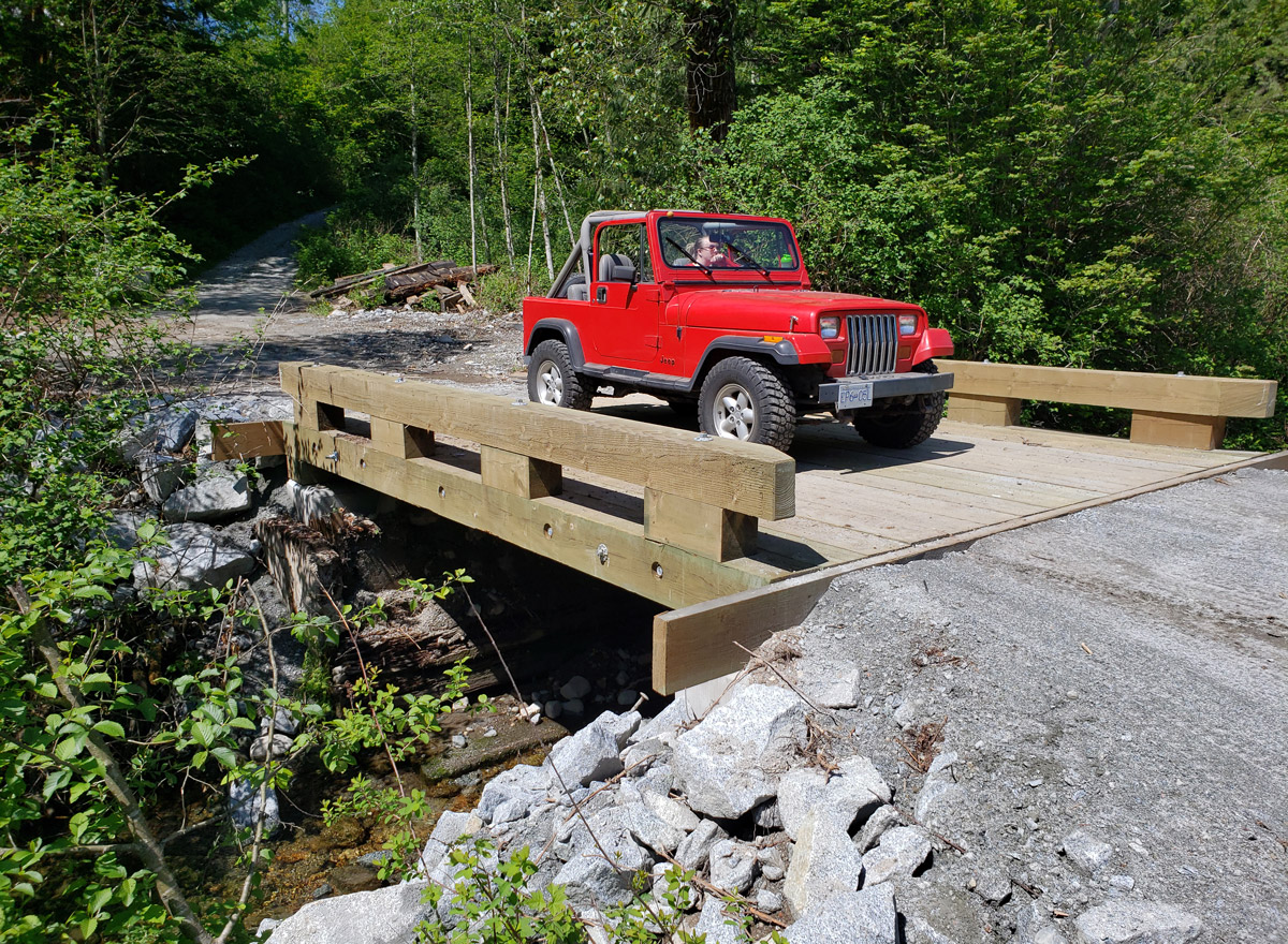 Car bridge made of Pacific HemFir with a red 4 wheel drive jeep