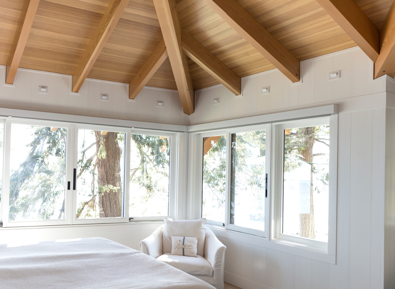 white wooden bedroom walls painted white with large windows